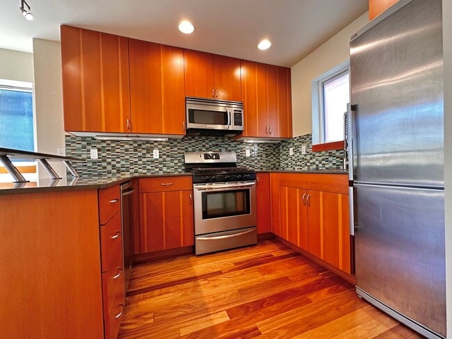 Building Photo - Three-Level Loft-Style 2BR | 3BA with Priv...