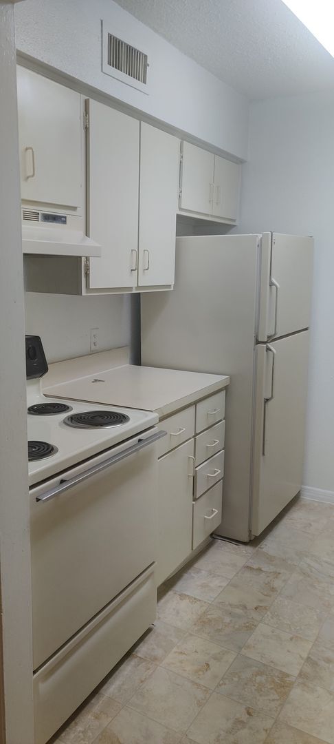 Building Photo - Ground Floor Two bedroom condo