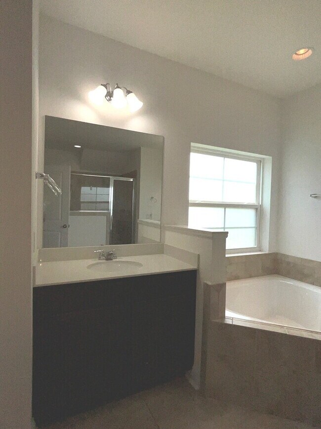 Building Photo - "Spacious 4-Bed Oasis with Stunning Lake V...