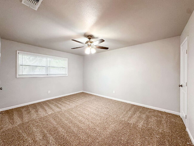 Building Photo - Spacious Living & Modern Upgrades