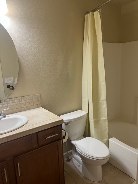 Guest bath upstairs with tub/shower, mirror cabinet, storage below - 5020 W Targee St