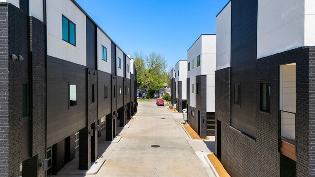 Building Photo - Discover modern elegance in the newly constructed Edgewater Condominiums, a boutique community fe...