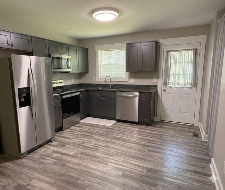 Modern kitchen with granite countertops and stinless steel appliances - 111 Buster Ln