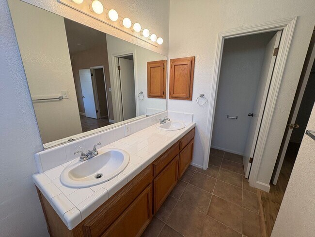 Building Photo - Spacious 3 Bedroom, 2 Bath Tevis Ranch Home with Fireplace, Covered Patio & 2-Car Garage