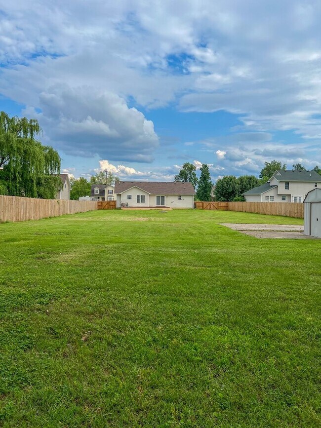 Building Photo - Massive Fenced Backyard with a Shed and Ga...