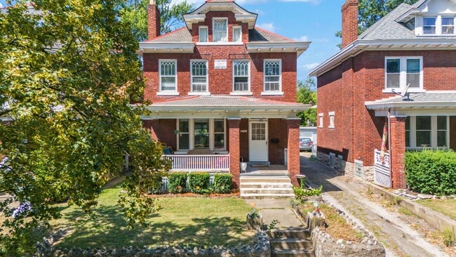Building Photo - Charming 5-Bedroom Home with Exposed Brick and Modern Upgrades