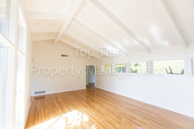 Building Photo - Charming Mid-Century Home | 4BR, 3BA | 2,4...