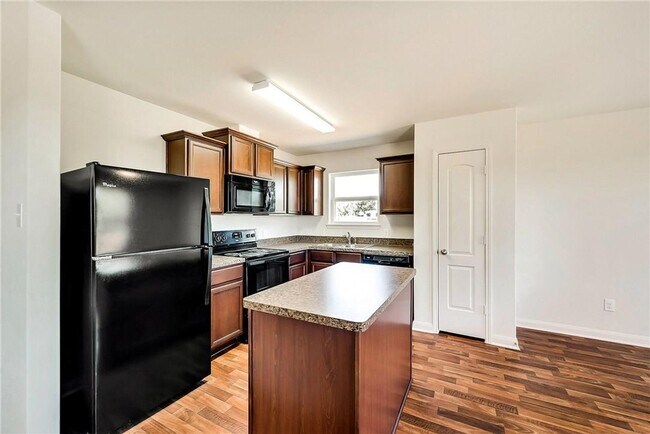 Building Photo - This lovely 4 bedroom home features a large family room with lots of light.