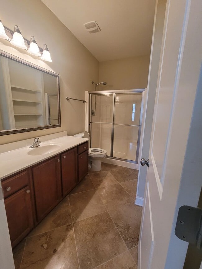 Building Photo - This 3 bedroom 2.5 bath brick townhouse with one car garage is located in Westgate Shoreline subd...