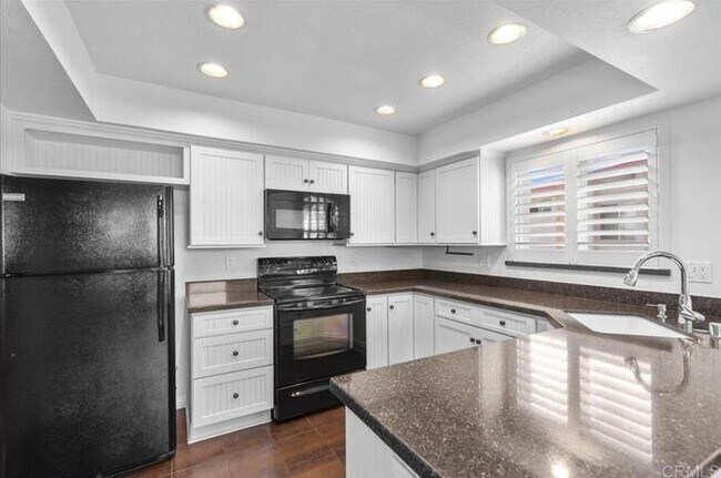 Building Photo - Poolside Living at Its Finest – Turnkey 3BR Condo with Direct Patio Access to the Pool