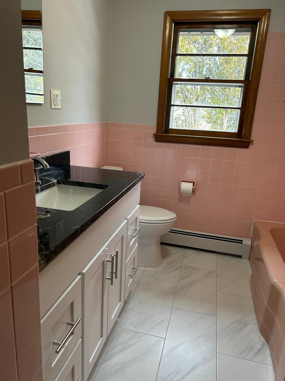Freshly renovated bathroom featuring a brand-new sink and modern vanity, offering a clean, updated l - 121 Pinehurst Ave