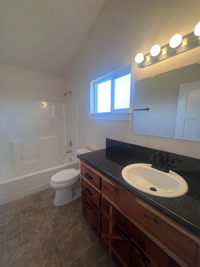 Building Photo - 2 Bedroom 1 bath house with extra large double car garage and extra storage space!