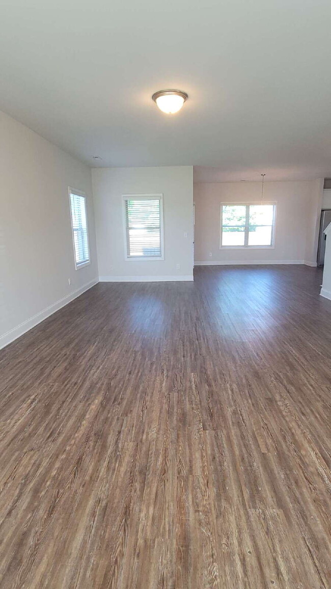 Building Photo - "Spacious 4-Bedroom Retreat with Modern Gr...