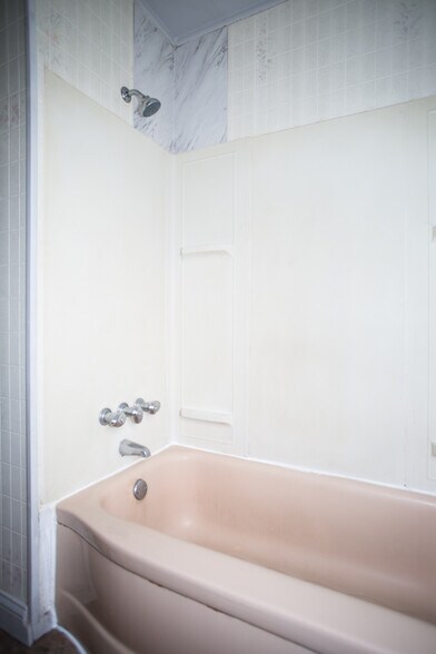 Bathtub with shower. - 10631 Saratoga st