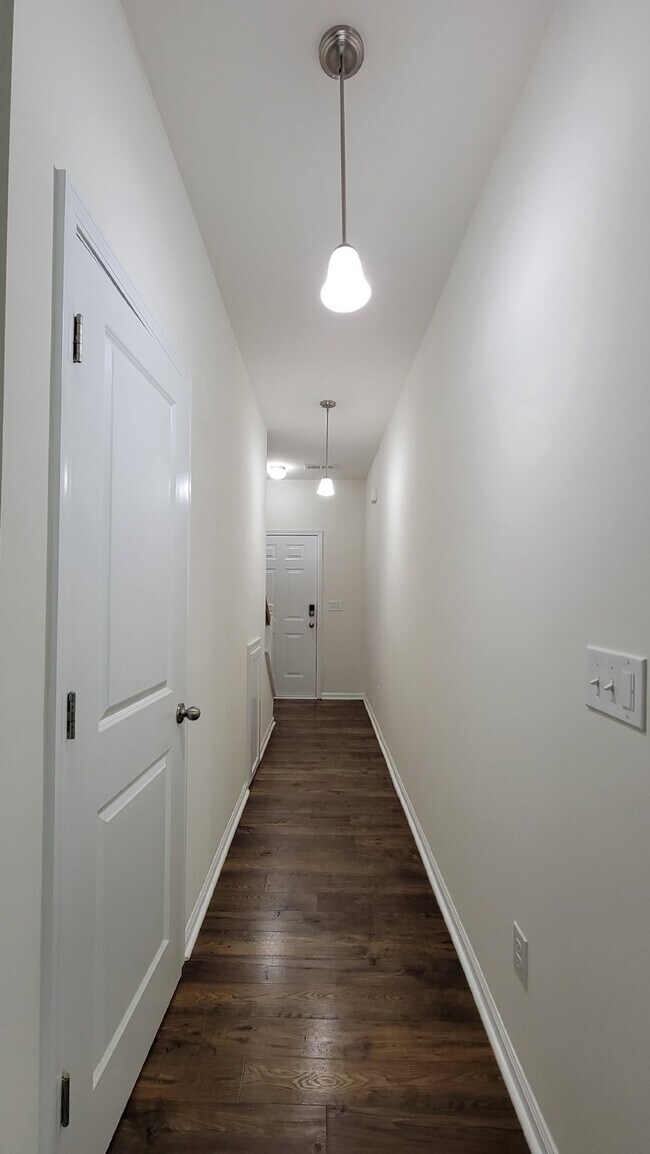 Building Photo - "Modern 3-Bedroom Multiplex with 3 Full Ba...