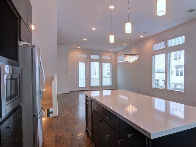 Living room with high ceilings and windows all around for natural light - 2719 Clay St