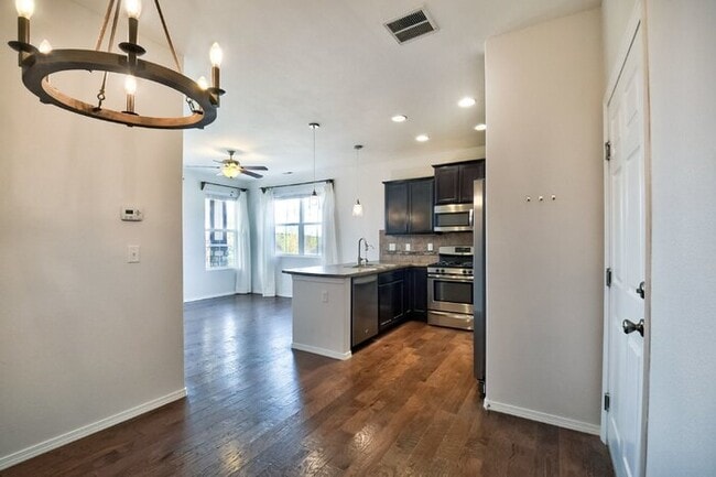 Building Photo - Immaculate 3-Bedroom Townhome with Stainless Steel Appliances and Attached Garage Near Peterson SFB