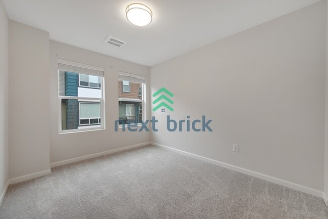 Building Photo - A Beautiful Corner Home Designed for Comfort, Light & Community!