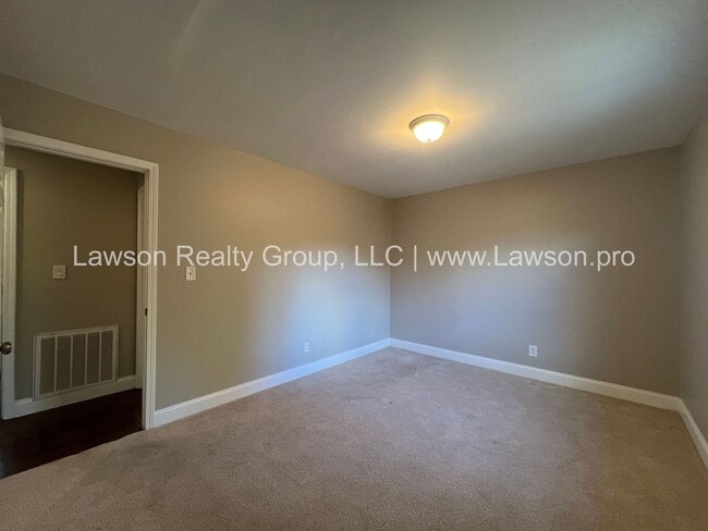 Building Photo - One Level Living- Beautifully Landscaped Yard and Attached Carport