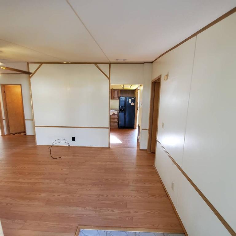 LIVING ROOM LOOKING TOWARD KITCHEN - 15017 Johansson Ave