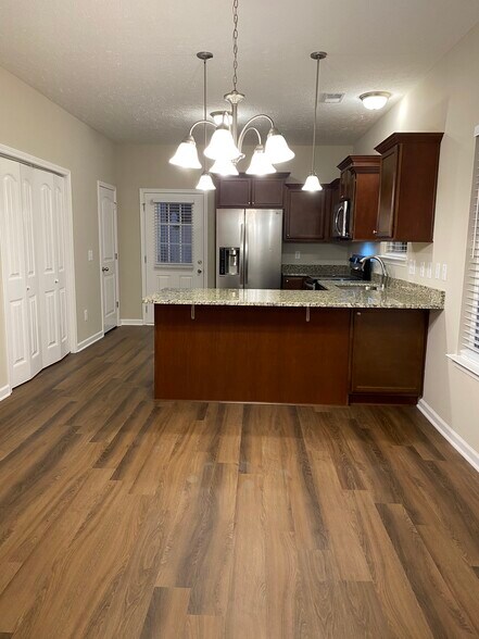 Open floorplan allows for dining right off the kitchen and living room - 5497 Cedar Ash Crossing