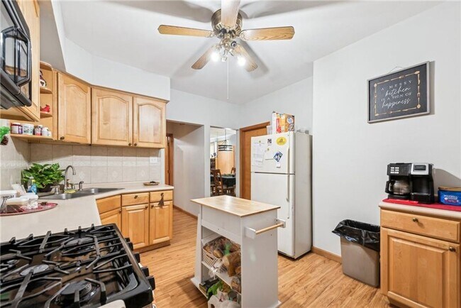 Building Photo - Bright and Roomy 6-Bedroom in McKees Rocks with Garage