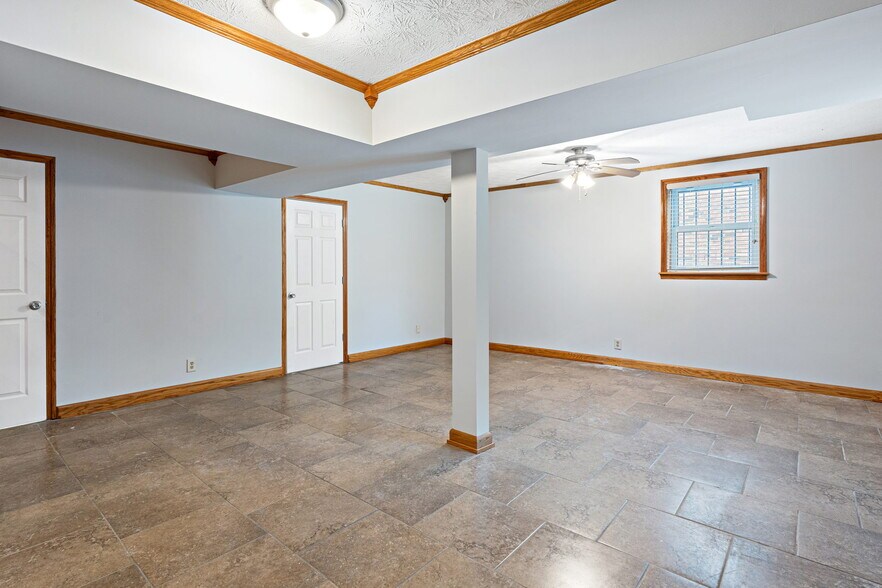 Downstairs den with Large storage closet and wet bar and natural light - 3841 Dubois Dr