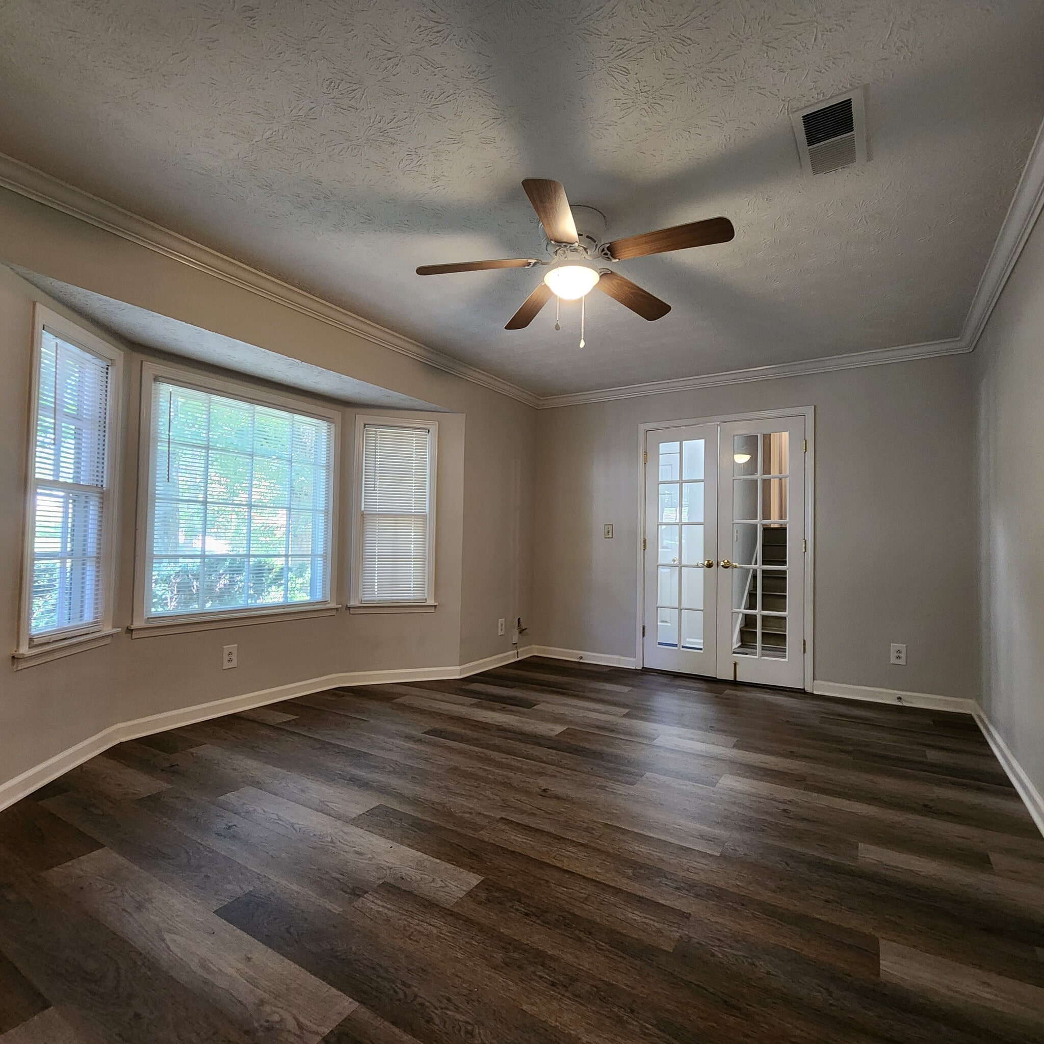 Living Room with Bay Window and French Doors - 1447 Ridgeland Ct SW