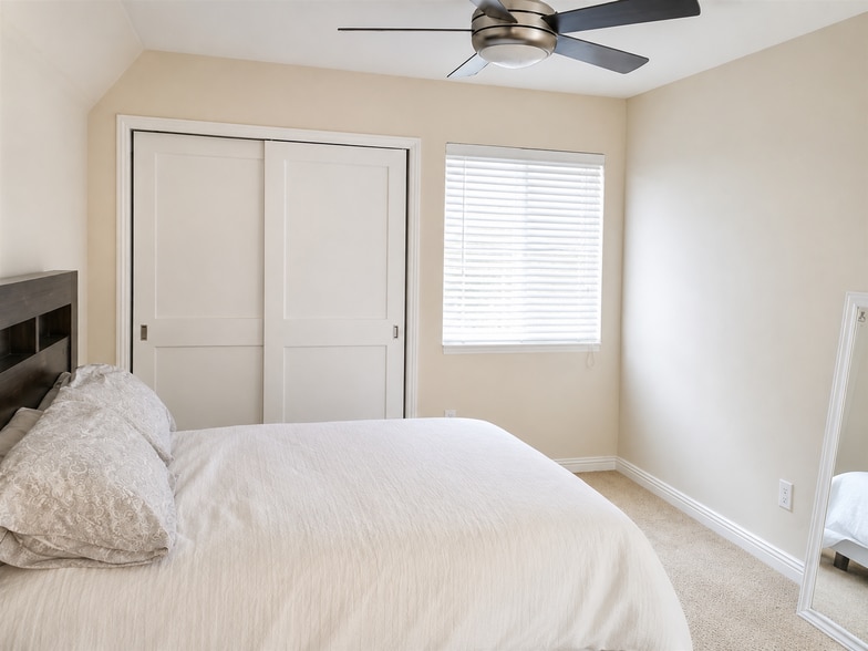 Primary Bedroom: Large primary bedroom with ensuite bath and ample closet space. - 6191 Rancho Mission Rd