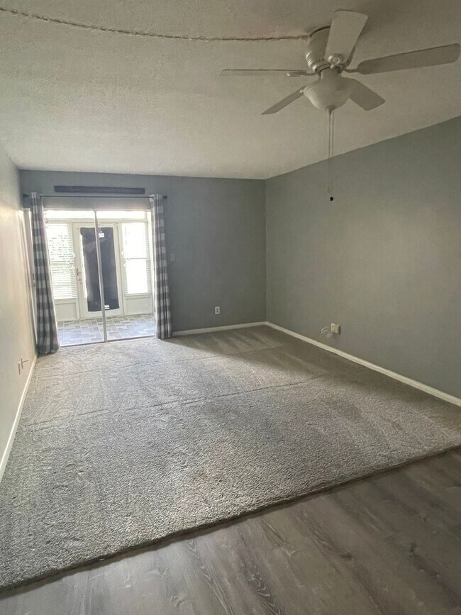 Building Photo - 55+ Charming first-floor condo nestled in ...