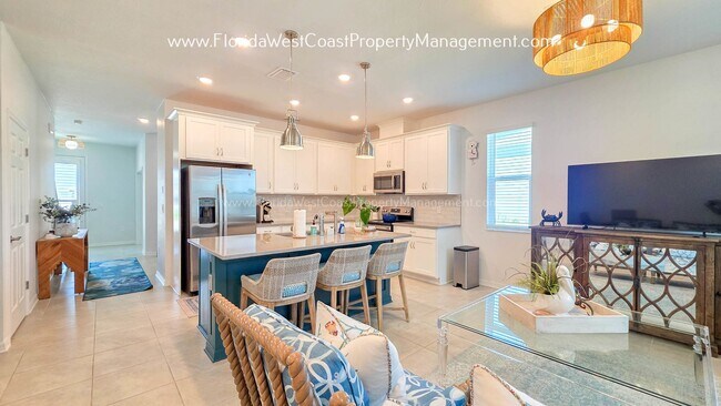 Building Photo - EXCEPTIONAL AND SPACIOUS FURNISHED TOWNHOME WITHIN WATERSIDE- NAUTIQUE!