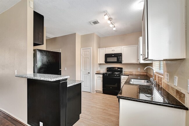 Building Photo - 23624 Wildwood Green Way