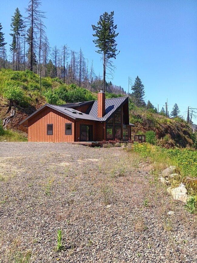Building Photo - Beautiful Chalet Style Riverfront Property...