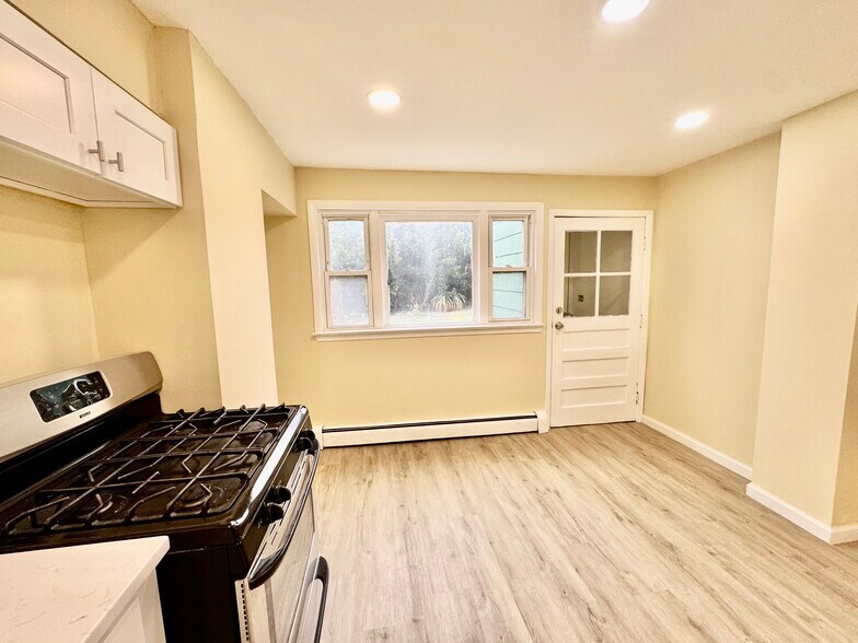 Kitchen w/ Private Backyard - 76 Greenville Ave