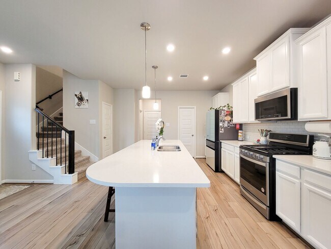 Building Photo - A true gem on a quiet corner lot, this spacious and sun-filled home is tucked away from street no...