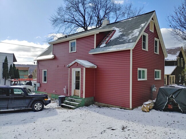 Back/side of house backyard (foundation painting will be completed before occupants move in)) - 835 Warren St