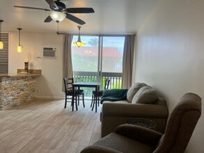 Building Photo - One bedroom semi-furnished bottom floor condo
