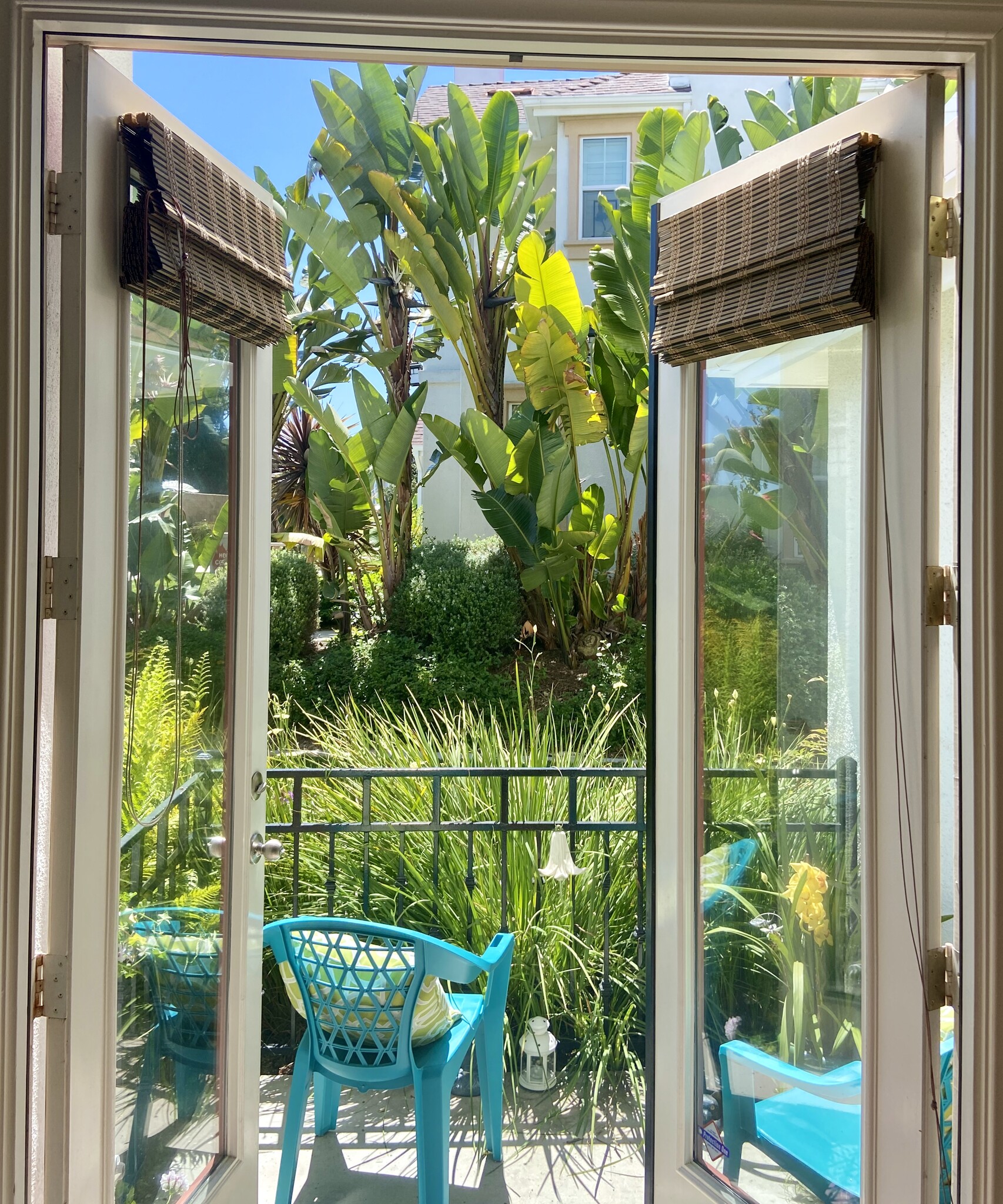 Patio among tropical plants - 820 Harbor Cliff Way