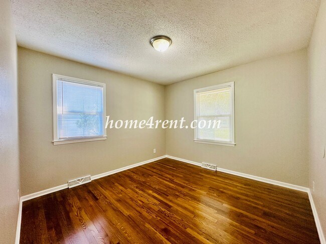 Building Photo - Updated Raytown Ranch w/ Wood Floors, SS Appliances, Finished Basement and a Fenced Yard!
