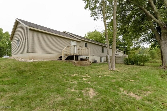 Building Photo - Spacious 3BR Duplex with Finished Basement & 2-Car Garage in Otsego