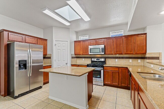 Building Photo - "Spacious 4-Bed Oasis with Granite Touches...