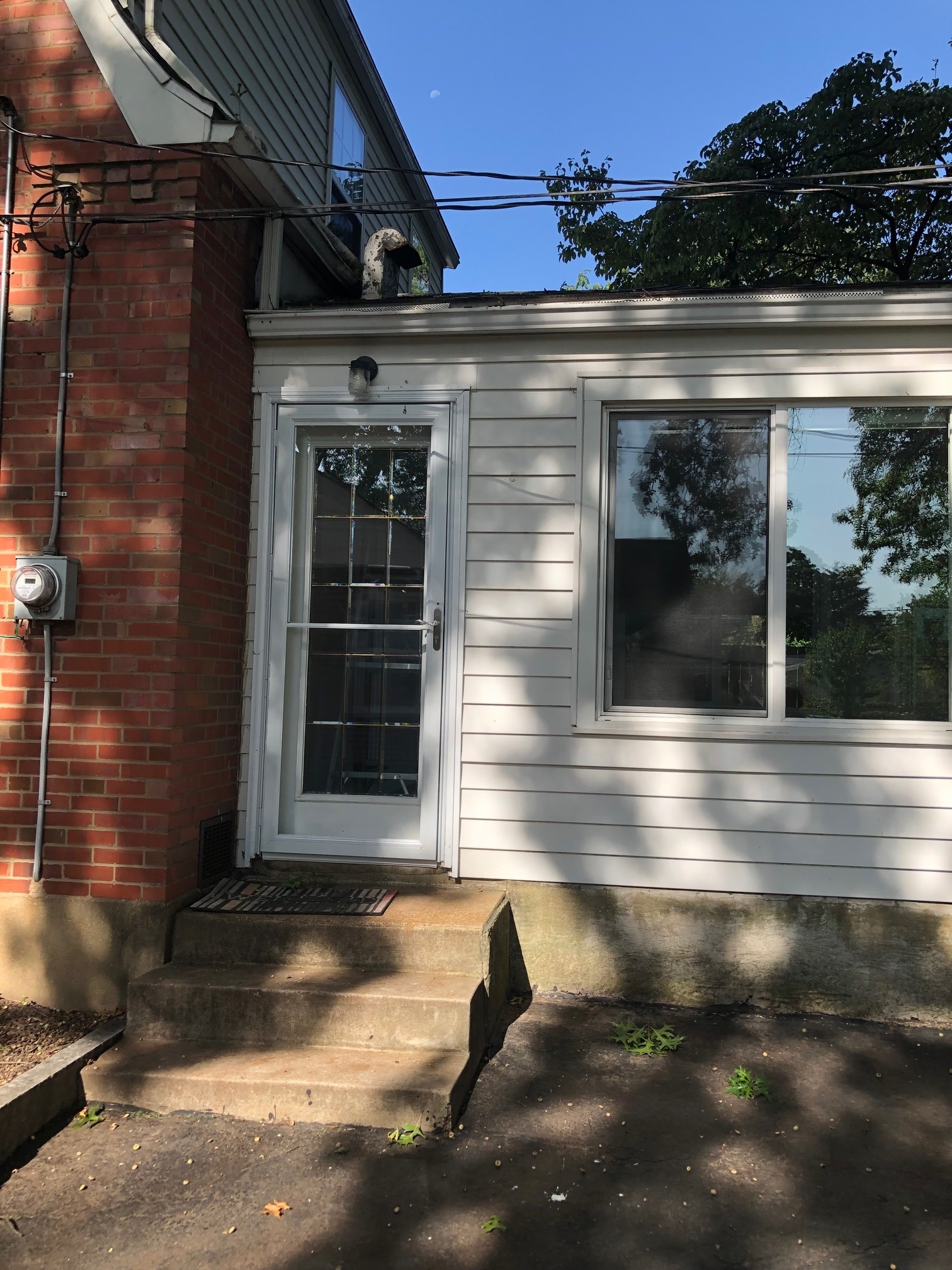 Back door entrance off the driveway - 6959 Pernod Ave