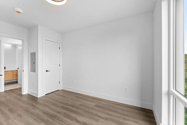 Building Photo - 2 Bedroom Corner-Unit with Wooded Balcony ...