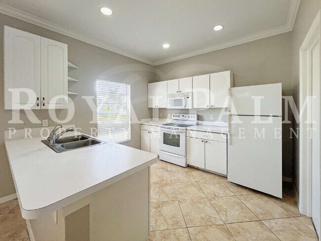 Building Photo - 3BR/2BA Home Ready to Bloom in Lehigh Acres + GARAGE!!