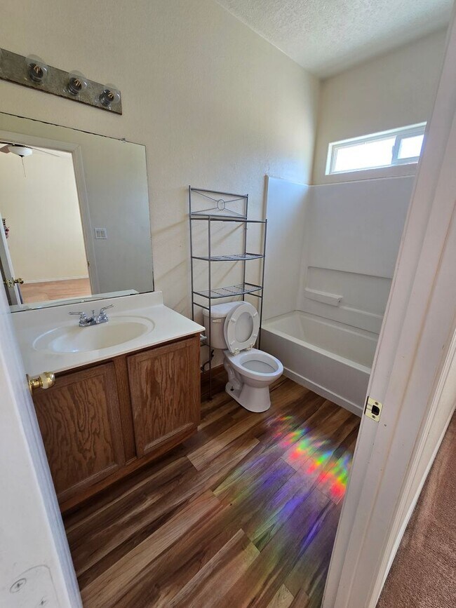 Building Photo - 4 bedroom 2 bath home with Refrigerated Air.