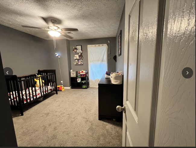 First bedroom upstairs to the right - 235 Colony Center Dr