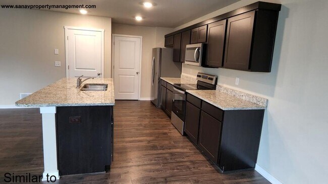 Building Photo - "Modern Luxury: Spacious 4-Bedroom Home with Open-Concept Design"