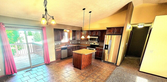 Open kitchen with plenty of cupboard space. - 2012 S Barret Pl