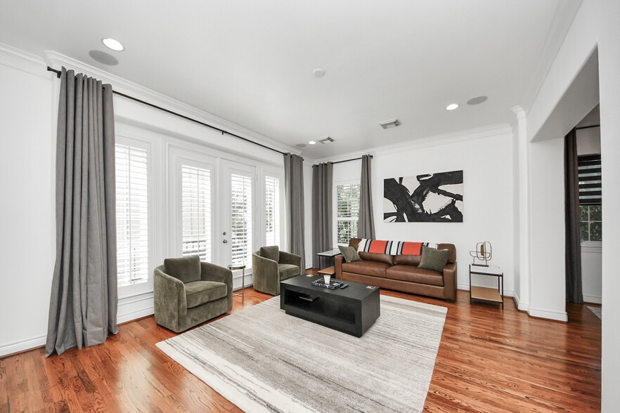 Soft textures, warm tones, and curated furnishings define the space. - 620 Rutland St