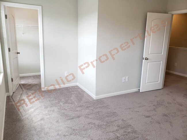Building Photo - Beautiful Luxury 3 Story 3 Bedroom Townhome with 1st Floor Guest Suite, Attached 2 Car Garage, Co...